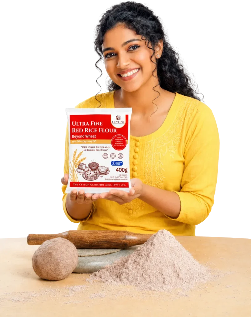 A smiling woman holding a retail package of Ceyfine Ultra Fine Red Rice Flour next to raw dough and flour pile